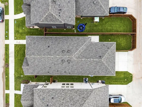 an aerial view of a house with a yard
