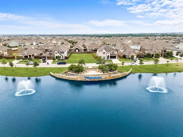 an aerial view of a house with a ocean view