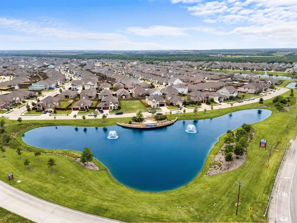 an aerial view of a house with a swimming pool