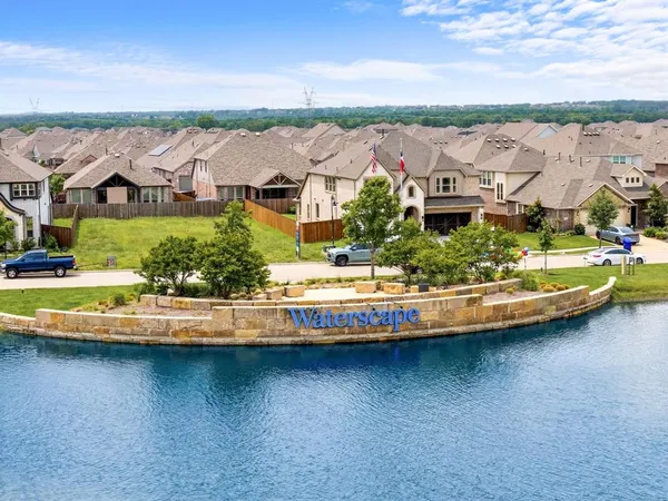 an aerial view of residential houses with outdoor space and swimming pool