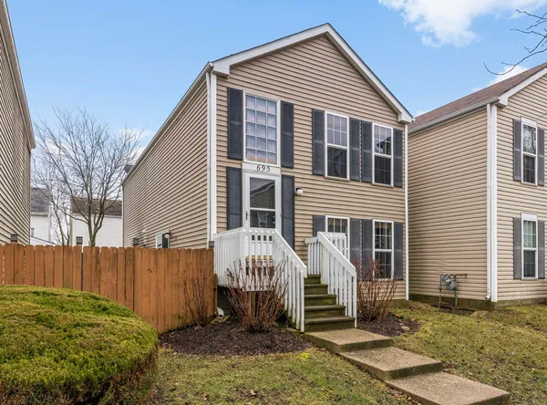 a front view of a house with garden