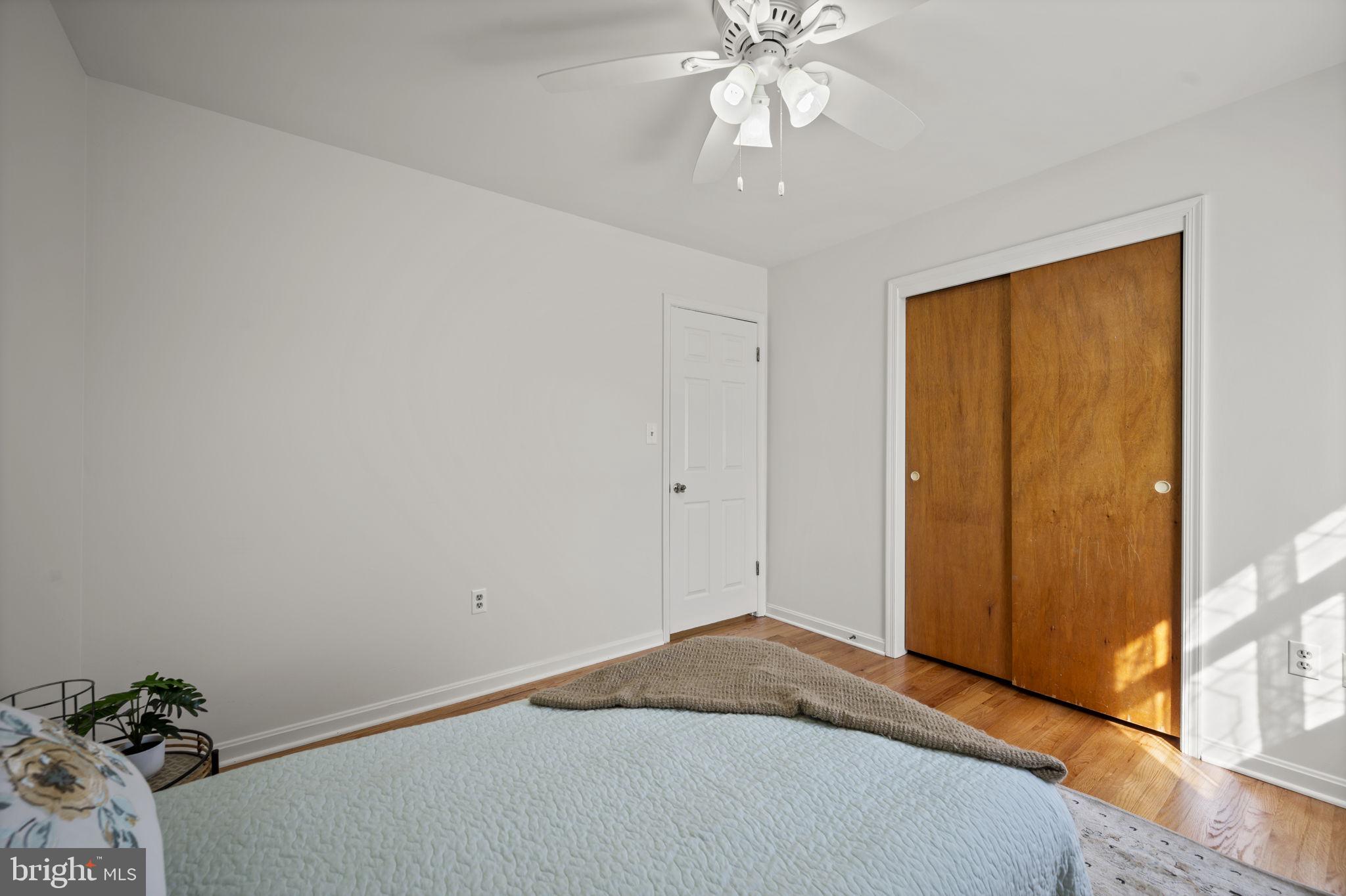 2502 Fox Road Fallston, MD 21047 - Photo 17 of 59 a bedroom with a bed and a chandelier fan