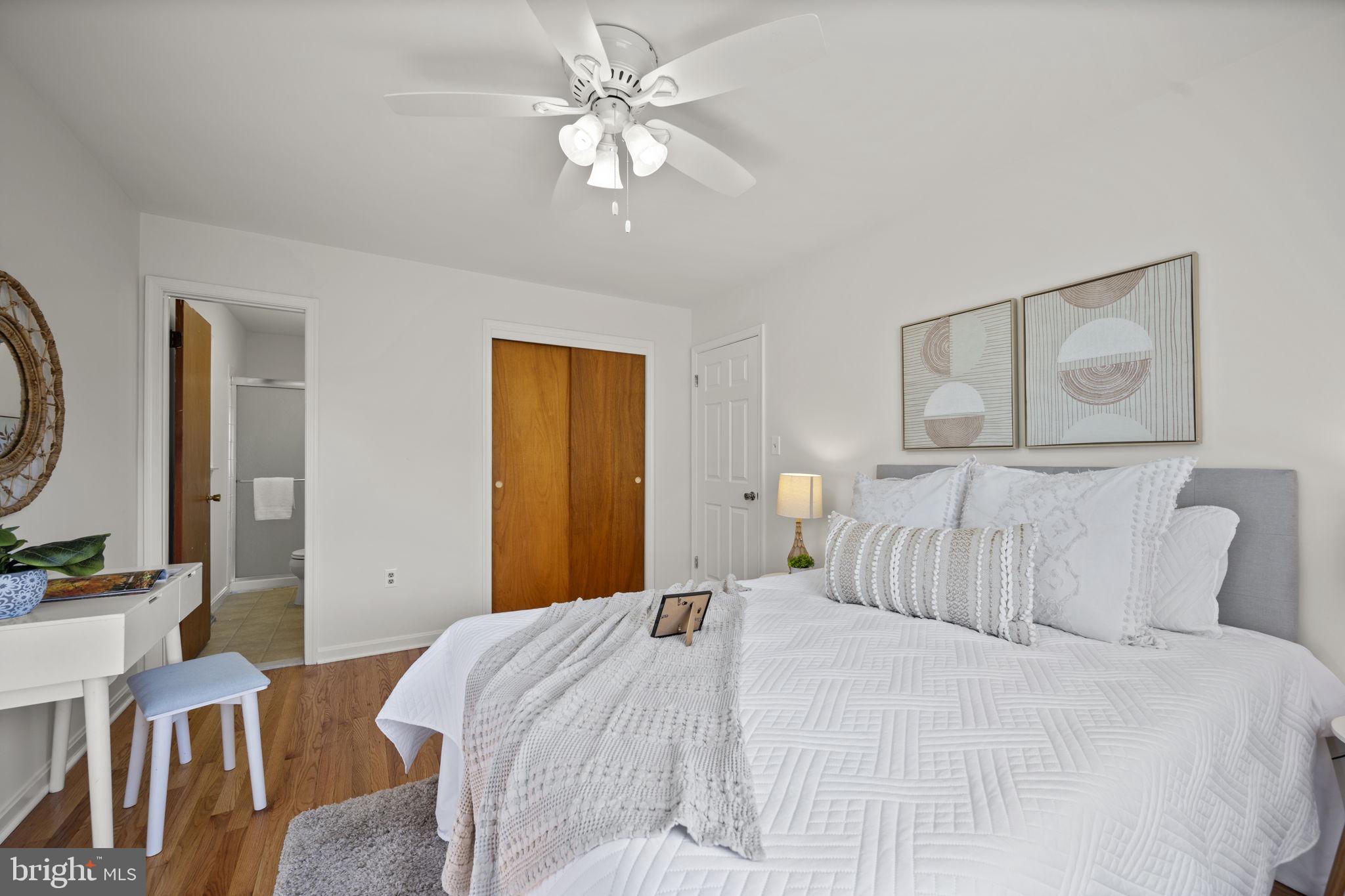 2502 Fox Road Fallston, MD 21047 - Photo 24 of 59 a bedroom with a large bed and a chandelier