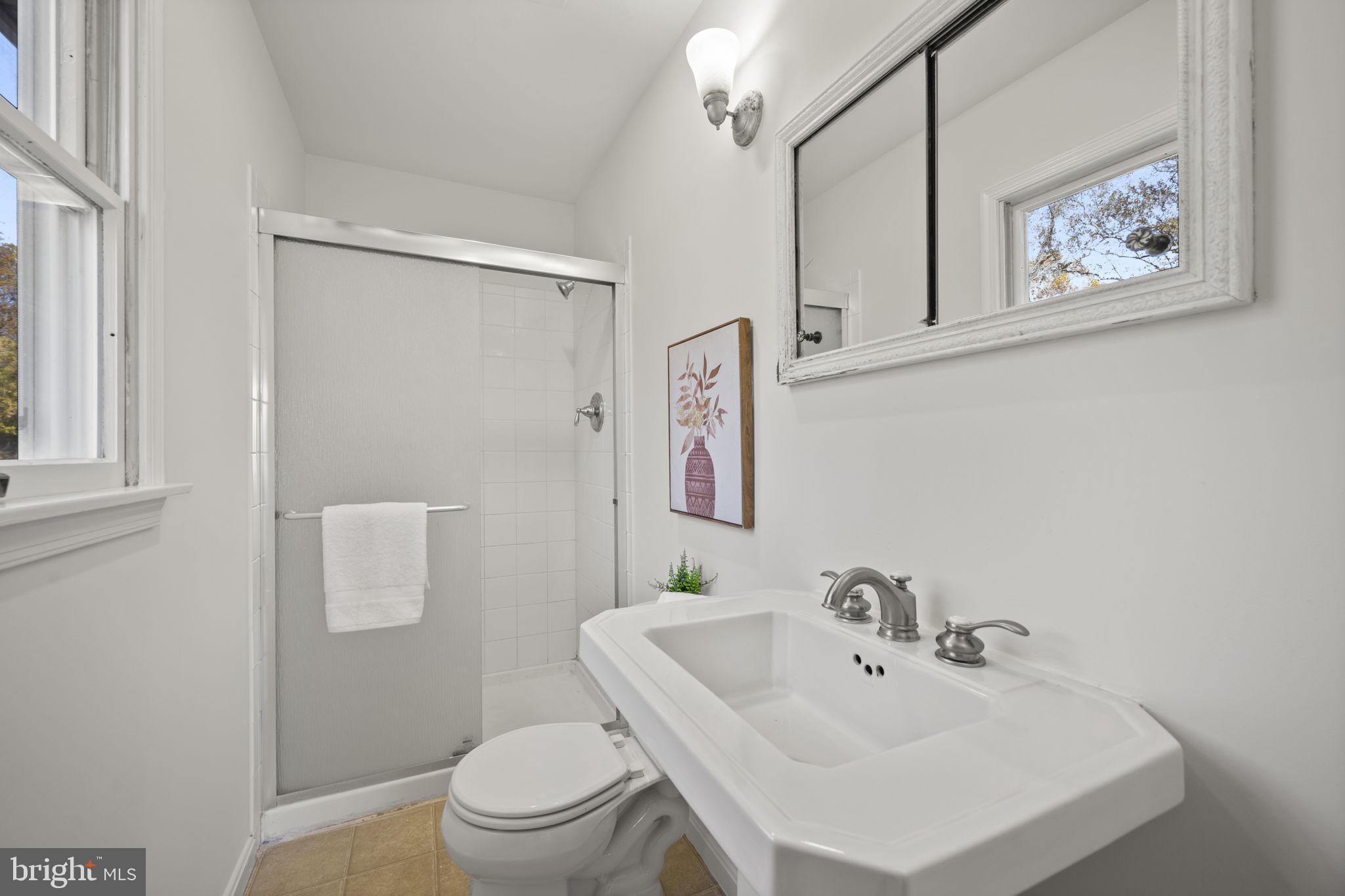 2502 Fox Road Fallston, MD 21047 - Photo 25 of 59 a bathroom with a sink mirror and toilet