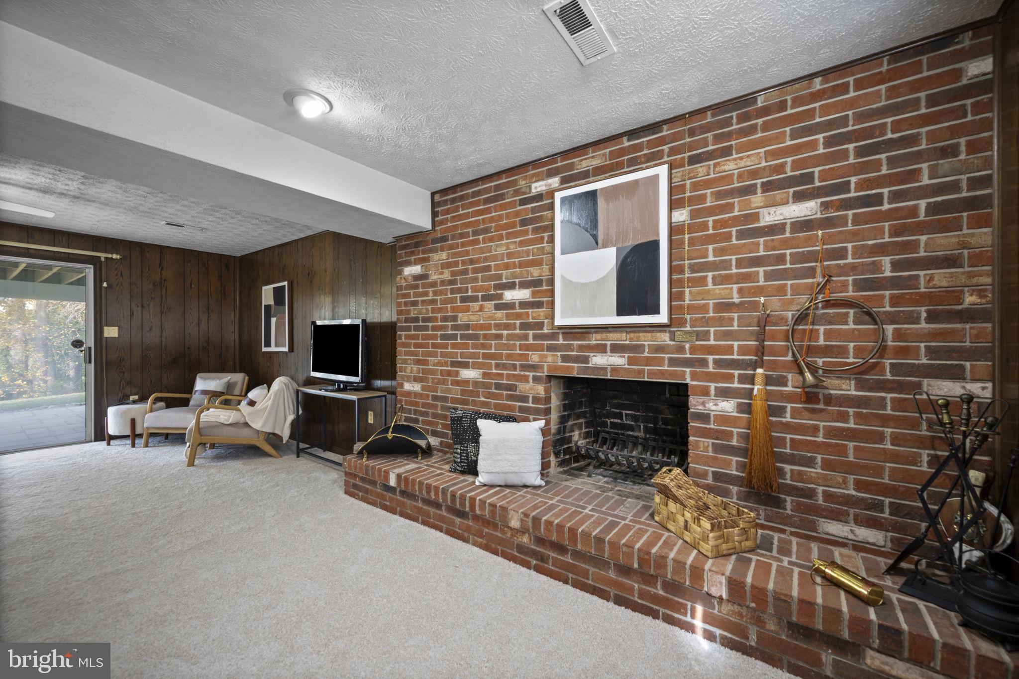 2502 Fox Road Fallston, MD 21047 - Photo 33 of 59 a living room with furniture a flat screen tv and a fireplace