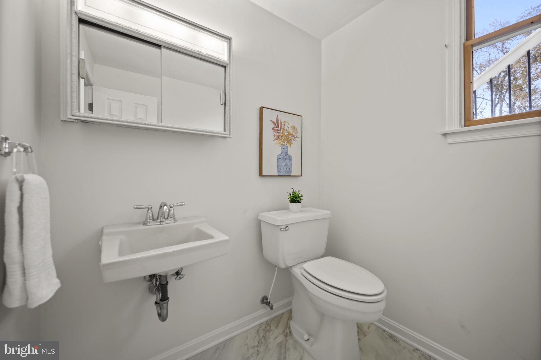 2502 Fox Road Fallston, MD 21047 - Photo 39 of 59 a bathroom with a toilet sink and mirror