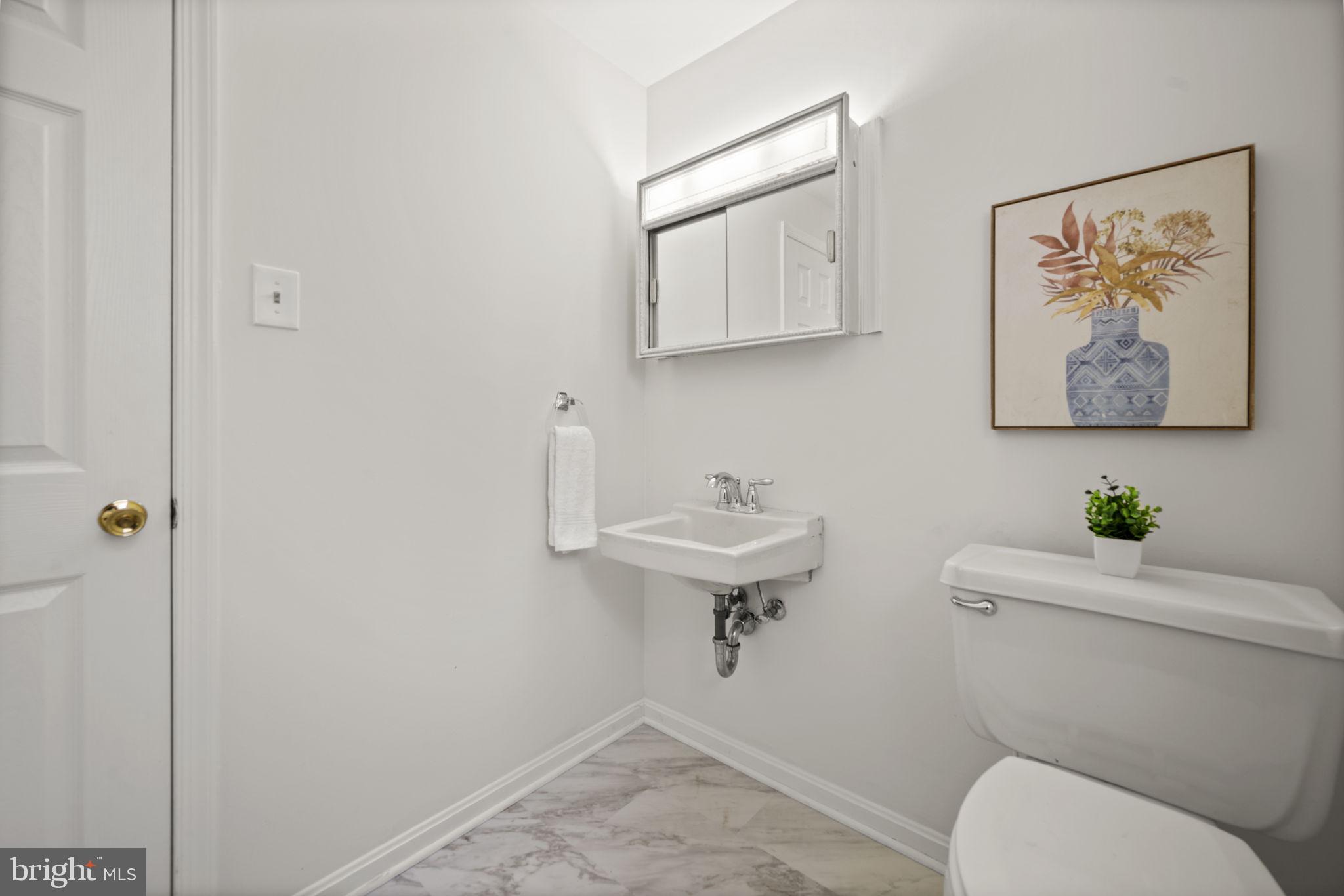 2502 Fox Road Fallston, MD 21047 - Photo 40 of 59 a bathroom with a toilet a sink and mirror