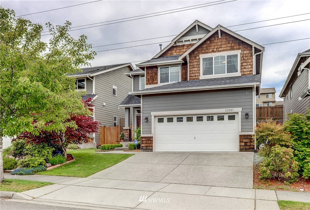 22921 42nd Drive Southeast Bothell, WA 98021 - Photo 1 of 38 a front view of a house with a yard and garage