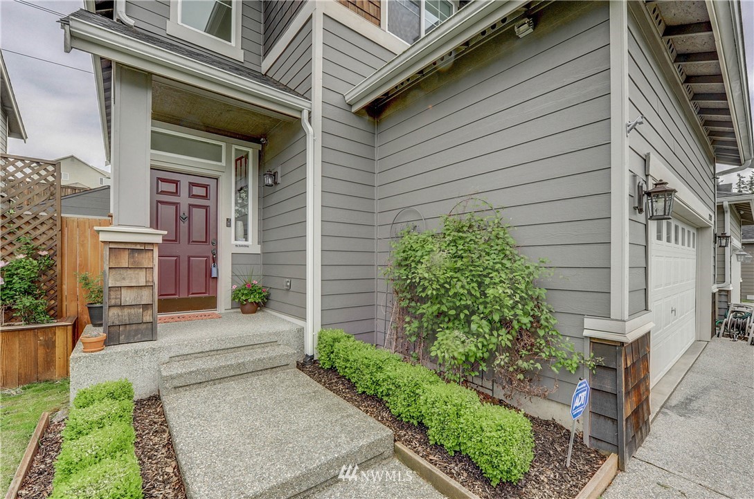 22921 42nd Drive Southeast Bothell, WA 98021 - Photo 2 of 38 a view of brick house with a yard and plants