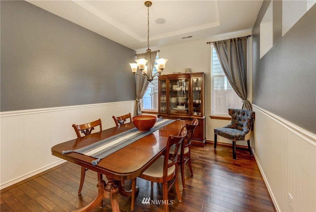 22921 42nd Drive Southeast Bothell, WA 98021 - Photo 15 of 38 a view of a dining room with furniture and wooden floor