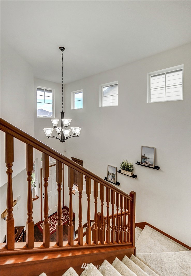 22921 42nd Drive Southeast Bothell, WA 98021 - Photo 21 of 38 a view of staircase with railing and a chandelier