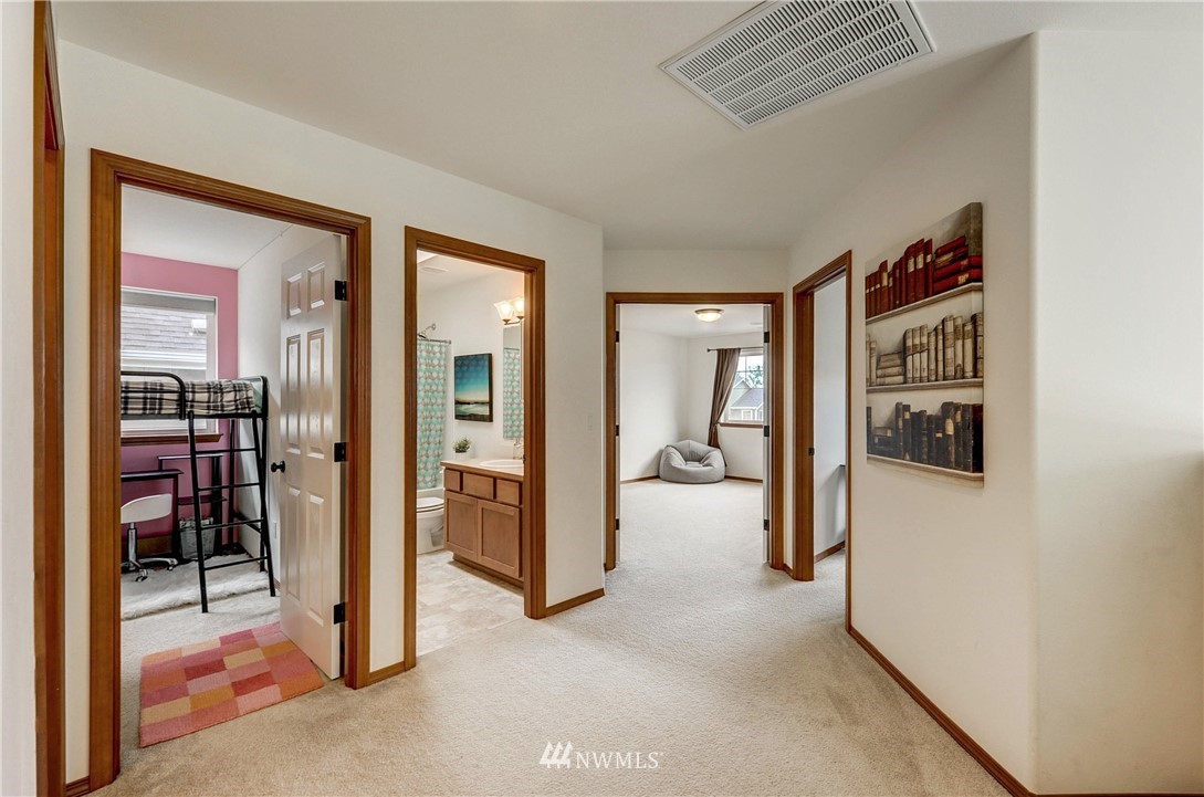 22921 42nd Drive Southeast Bothell, WA 98021 - Photo 22 of 38 a view of a livingroom with wooden floor and a flat screen tv