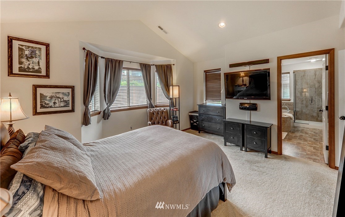 22921 42nd Drive Southeast Bothell, WA 98021 - Photo 23 of 38 a bedroom with a bed and a flat screen tv