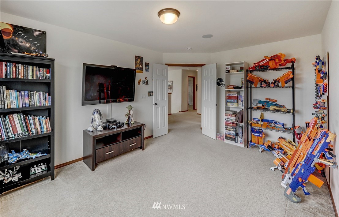 22921 42nd Drive Southeast Bothell, WA 98021 - Photo 33 of 38 a living room with lots of furniture and a flat screen tv