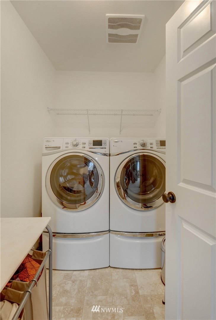 22921 42nd Drive Southeast Bothell, WA 98021 - Photo 34 of 38 a utility room with dryer and washer