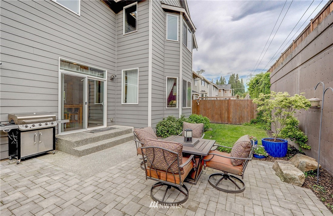 22921 42nd Drive Southeast Bothell, WA 98021 - Photo 36 of 38 a view of a backyard with furniture and a fire pit