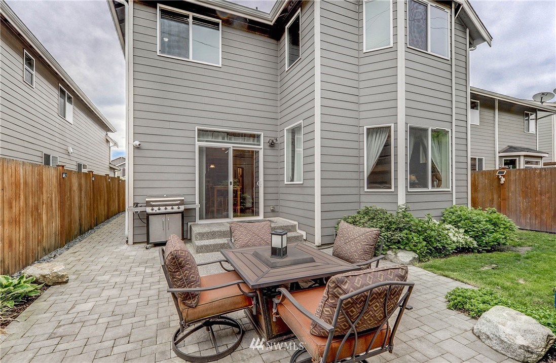 22921 42nd Drive Southeast Bothell, WA 98021 - Photo 37 of 38 a backyard of a house with table and chairs