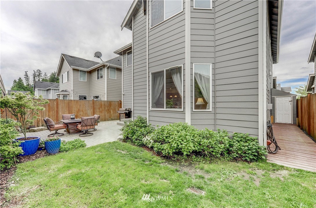 22921 42nd Drive Southeast Bothell, WA 98021 - Photo 38 of 38 a backyard of a house with outdoor seating and barbeque oven