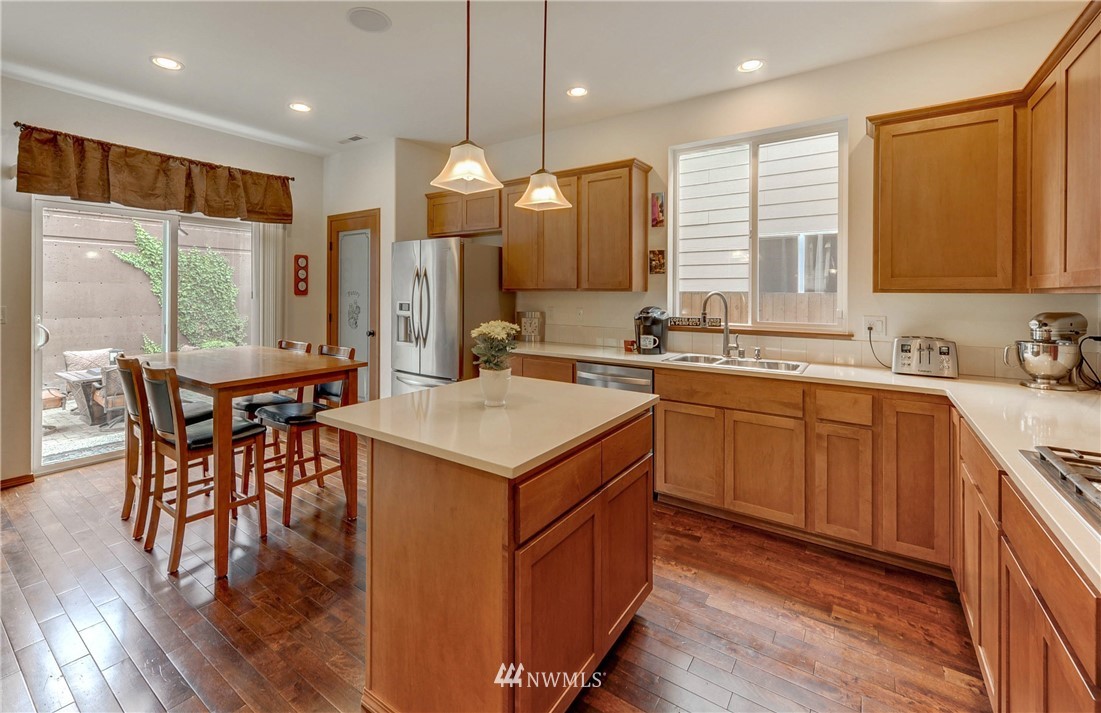 22921 42nd Drive Southeast Bothell, WA 98021 - Photo 7 of 38 a kitchen with a sink a counter top space appliances and cabinets