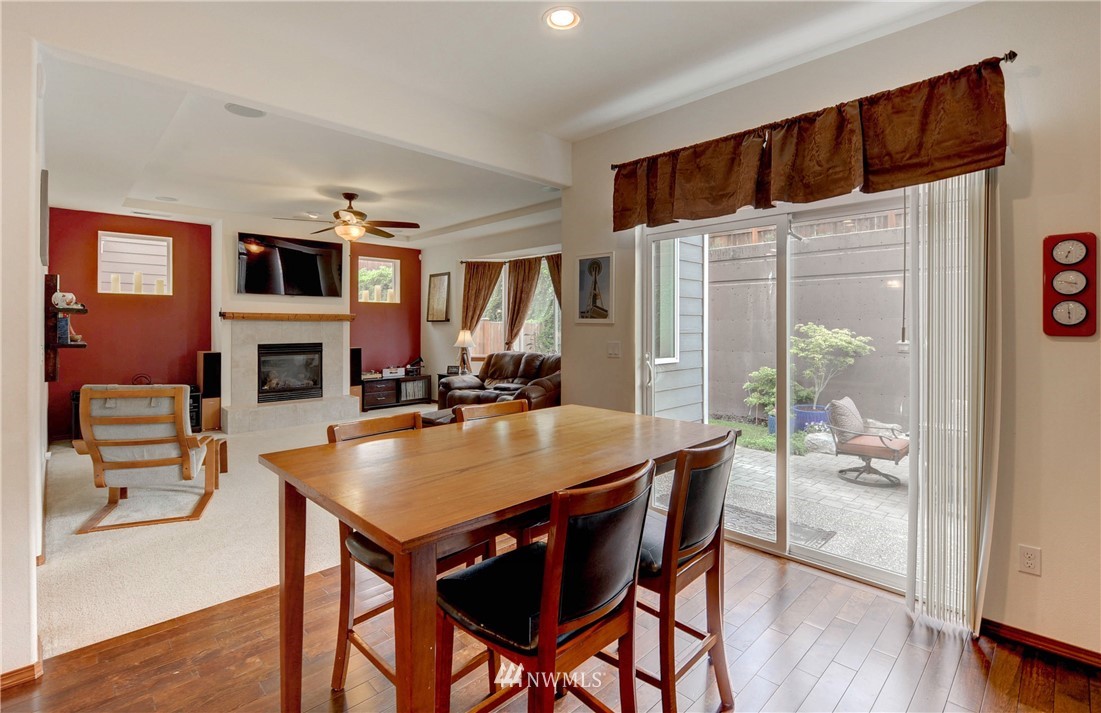 22921 42nd Drive Southeast Bothell, WA 98021 - Photo 9 of 38 a view of a dining room with furniture window and wooden floor