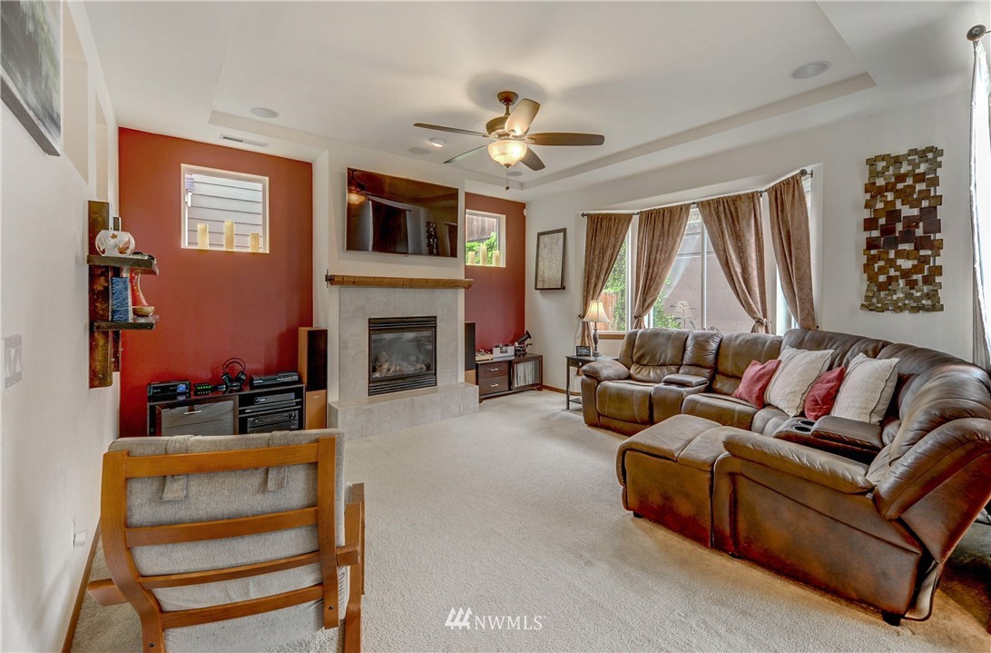 22921 42nd Drive Southeast Bothell, WA 98021 - Photo 10 of 38 a living room with furniture fireplace and a large window