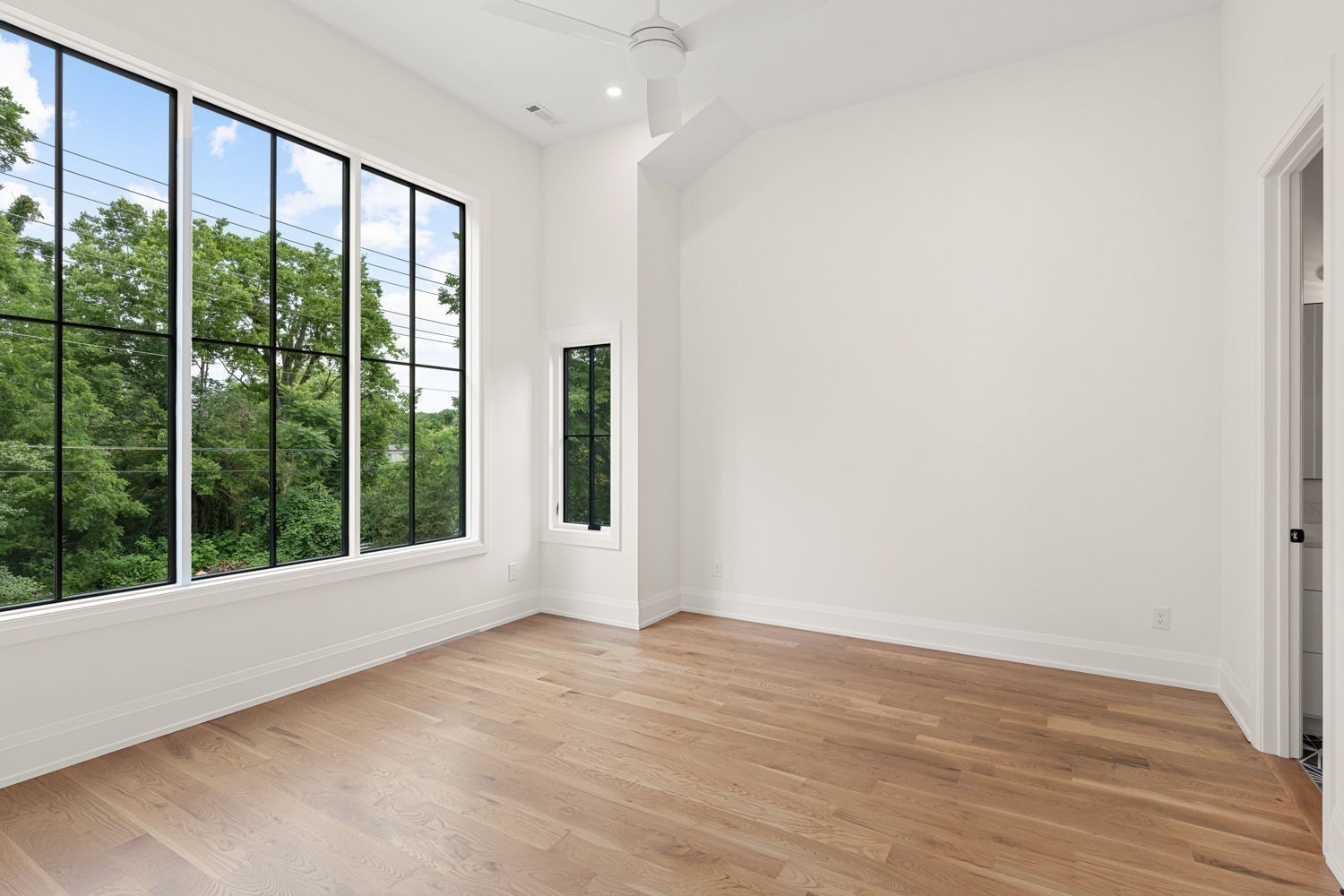 2915 Compton Road Nashville, TN 37215 - Photo 37 of 75 a view of an empty room with wooden floor and a window