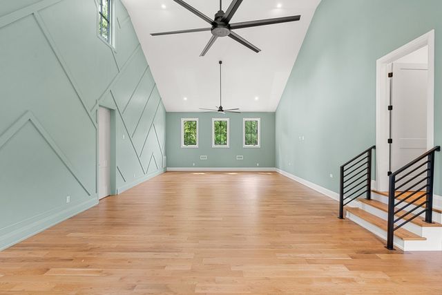 a front view of a house with a yard table and chairs