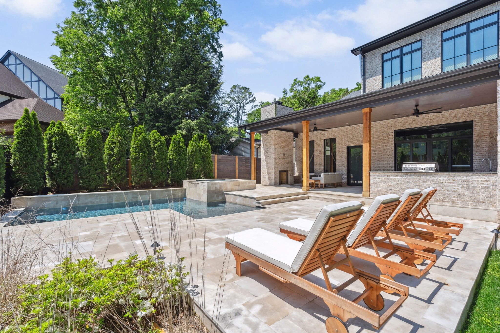 2915 Compton Road Nashville, TN 37215 - Photo 65 of 75 a view of a patio with table and chairs potted plants and large tree