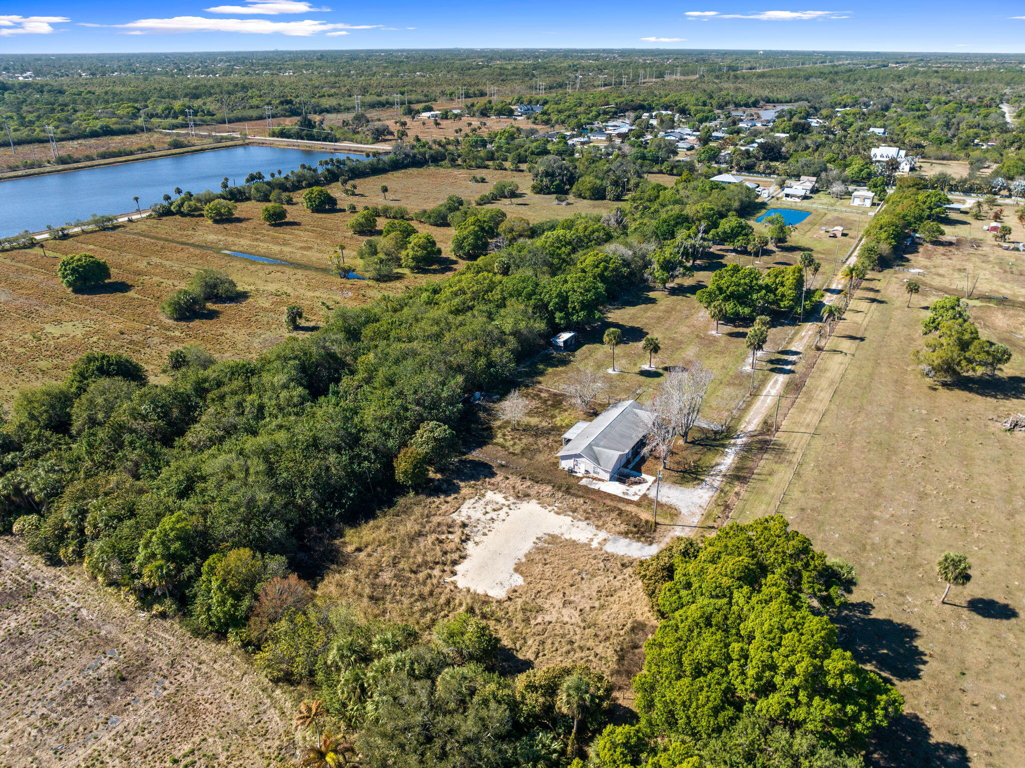 6406 Oleander Avenue Fort Pierce, FL 34982 - Photo 7 of 9 an aerial view of residential houses with outdoor space