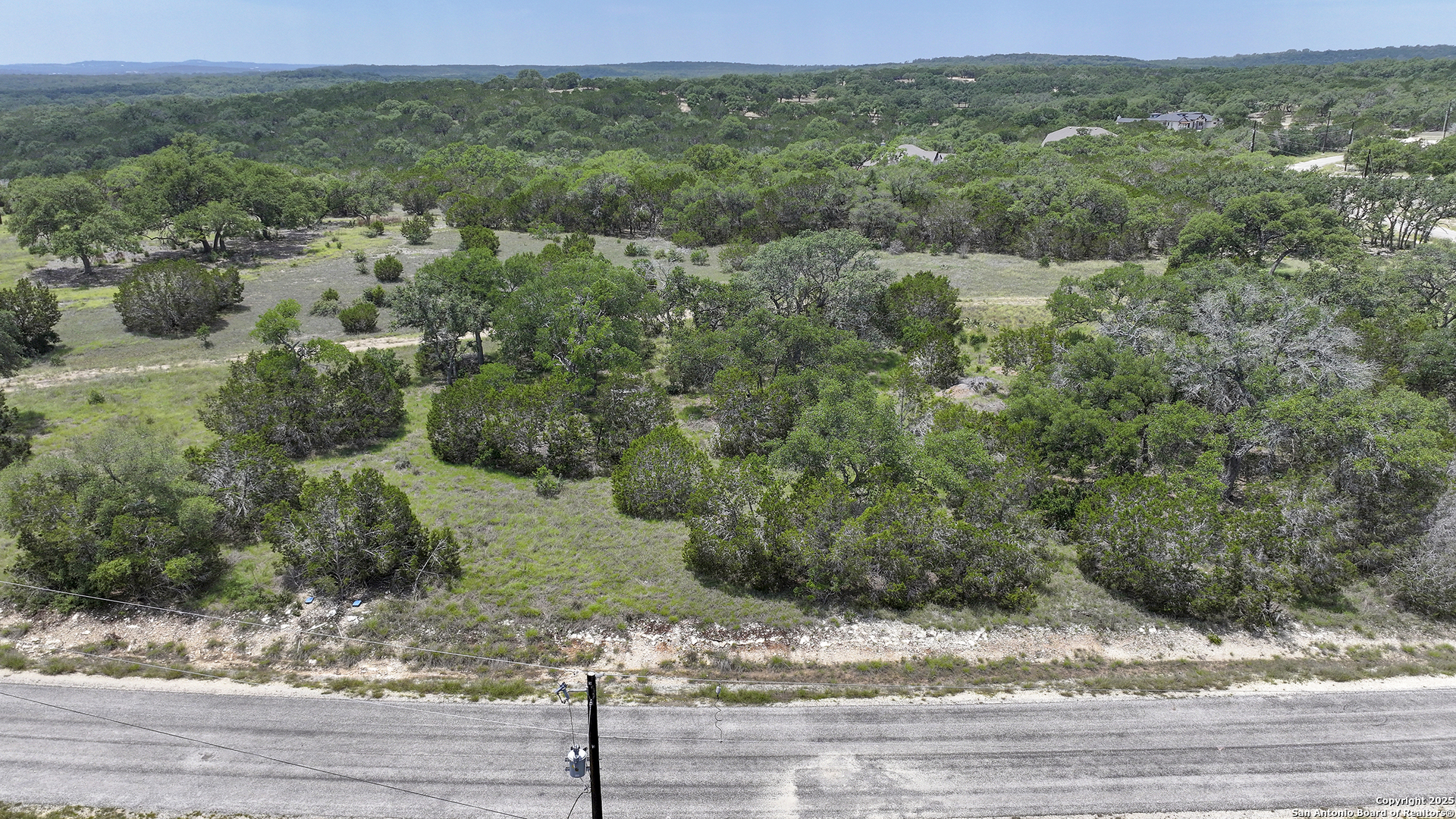 314 Serenity Pass Spring Branch, TX 78070 - Photo 16 of 26 a view of a forest with a street
