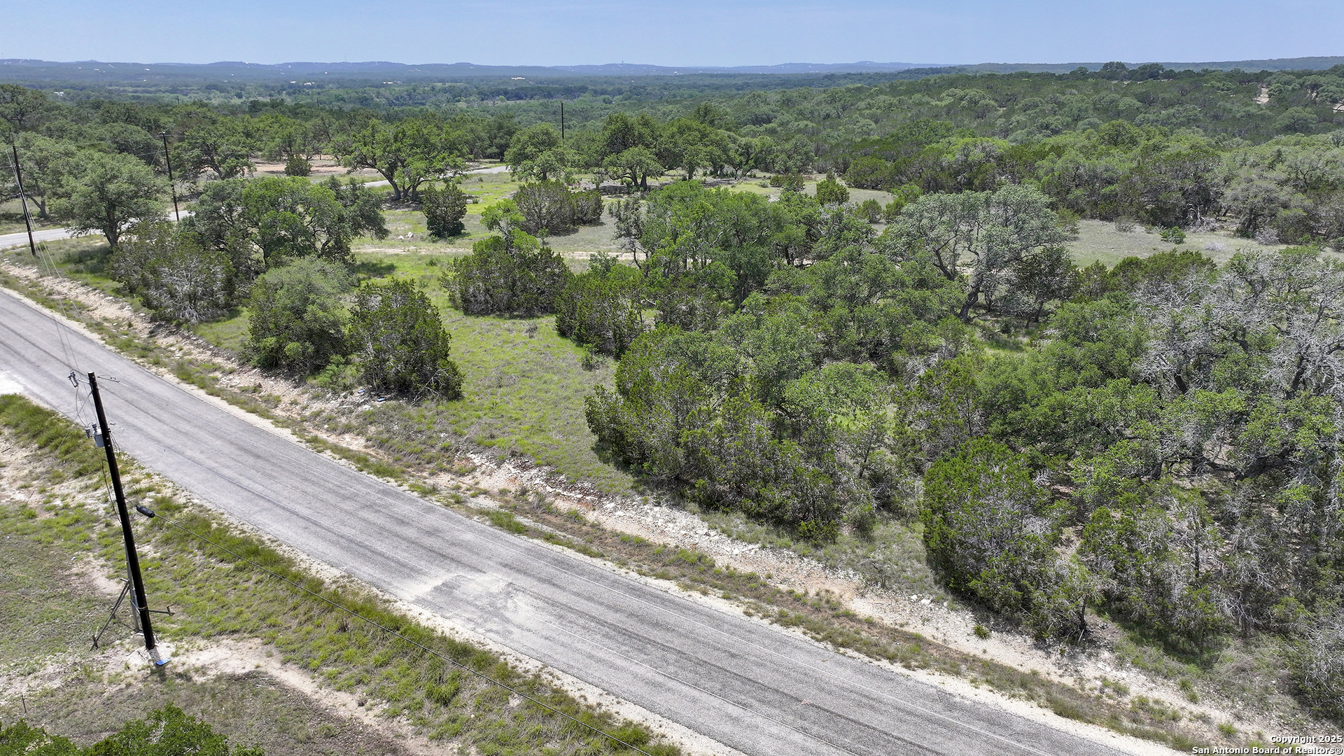 314 Serenity Pass Spring Branch, TX 78070 - Photo 17 of 26 a view of a yard with wooden fence