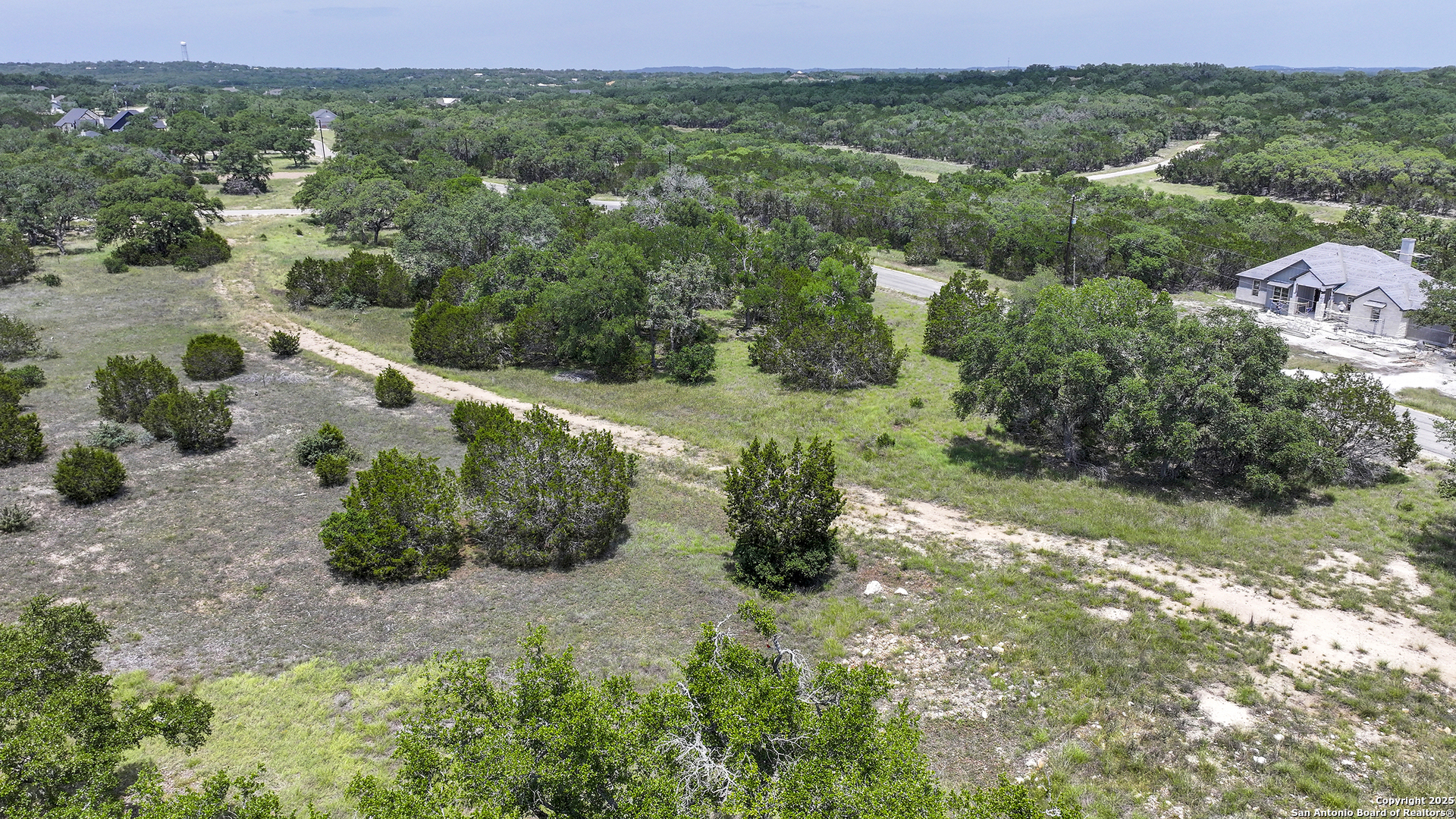 314 Serenity Pass Spring Branch, TX 78070 - Photo 21 of 26 an aerial view of a house with a yard