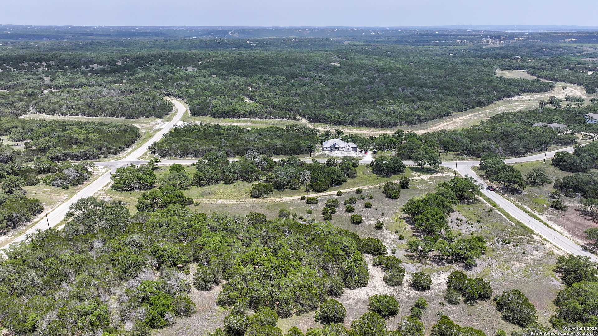 314 Serenity Pass Spring Branch, TX 78070 - Photo 6 of 26 a view of a lush green field with lots of bushes