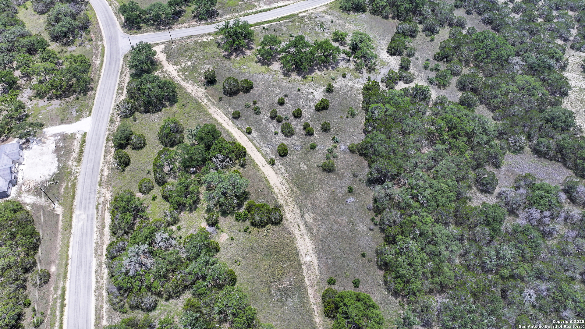 314 Serenity Pass Spring Branch, TX 78070 - Photo 7 of 26 an aerial view of a house with a yard and plants