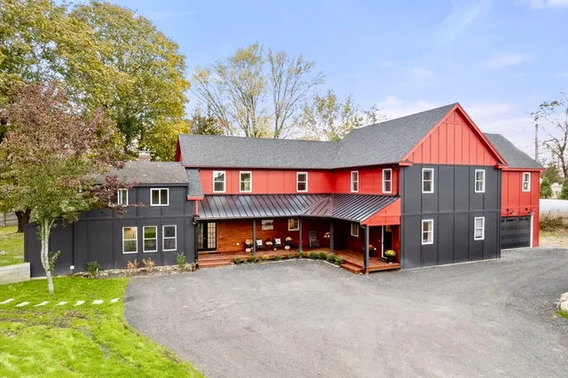 a view of a car park in front of house