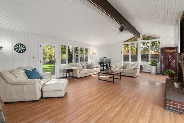 a living room with furniture and a table