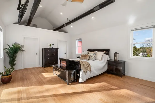 a spacious bedroom with a bed and furniture