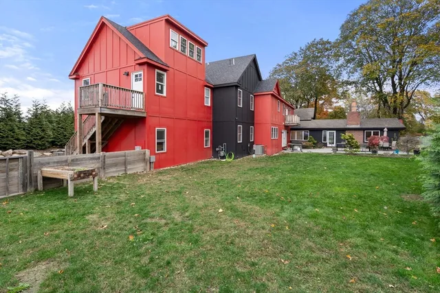 a front view of a house with a yard table and chairs