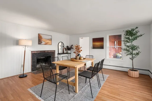 a view of a livingroom with furniture and a fireplace