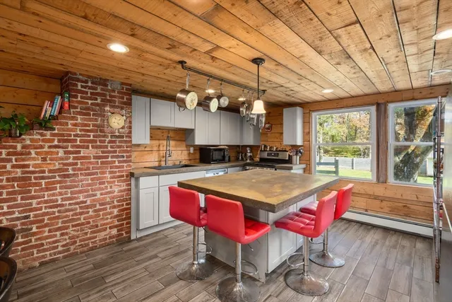 a kitchen with a wooden cabinets and stove