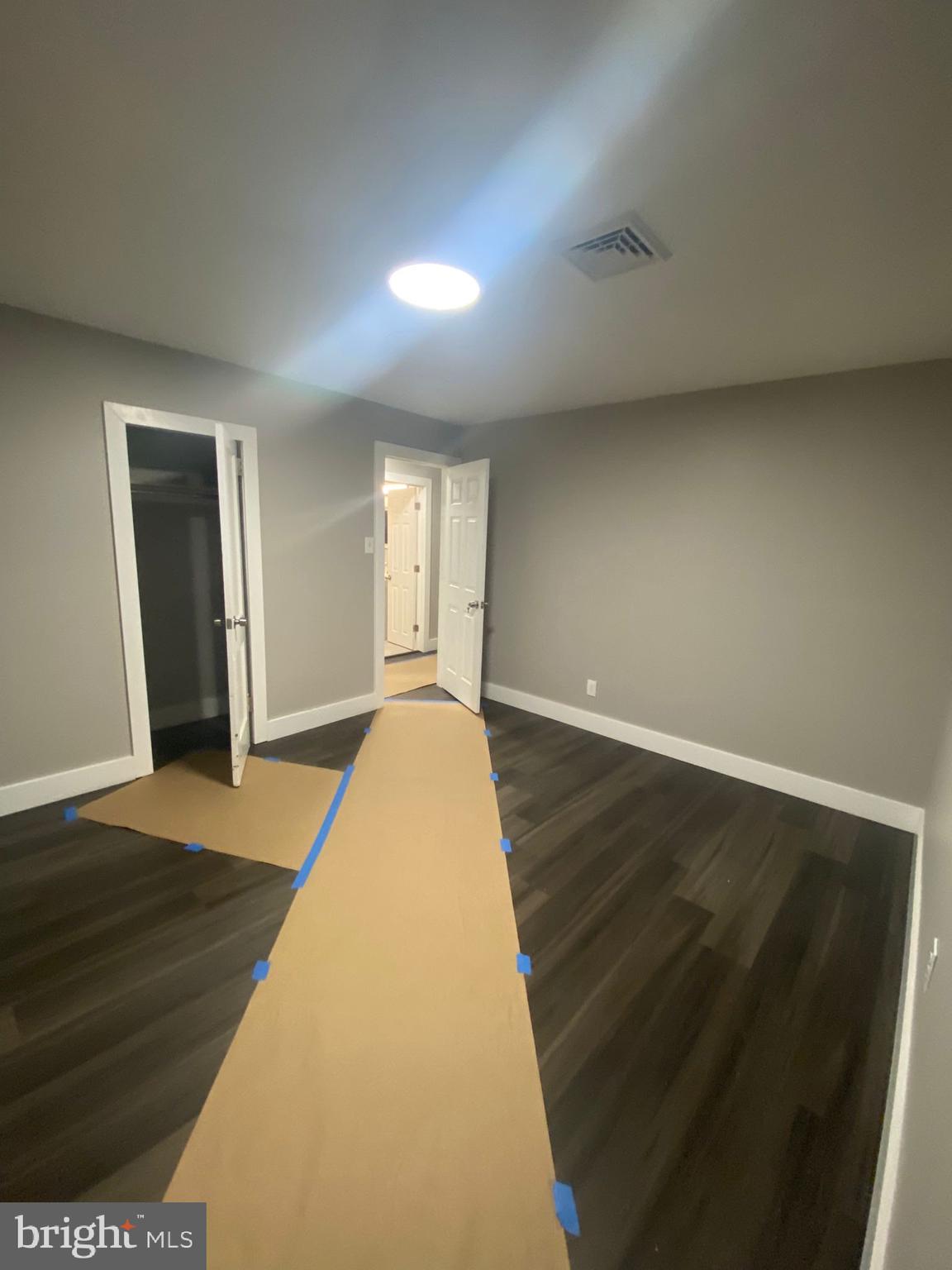 203 Kinsley Road Pemberton, NJ 08068 - Photo 3 of 9 a view of empty room with wooden floor