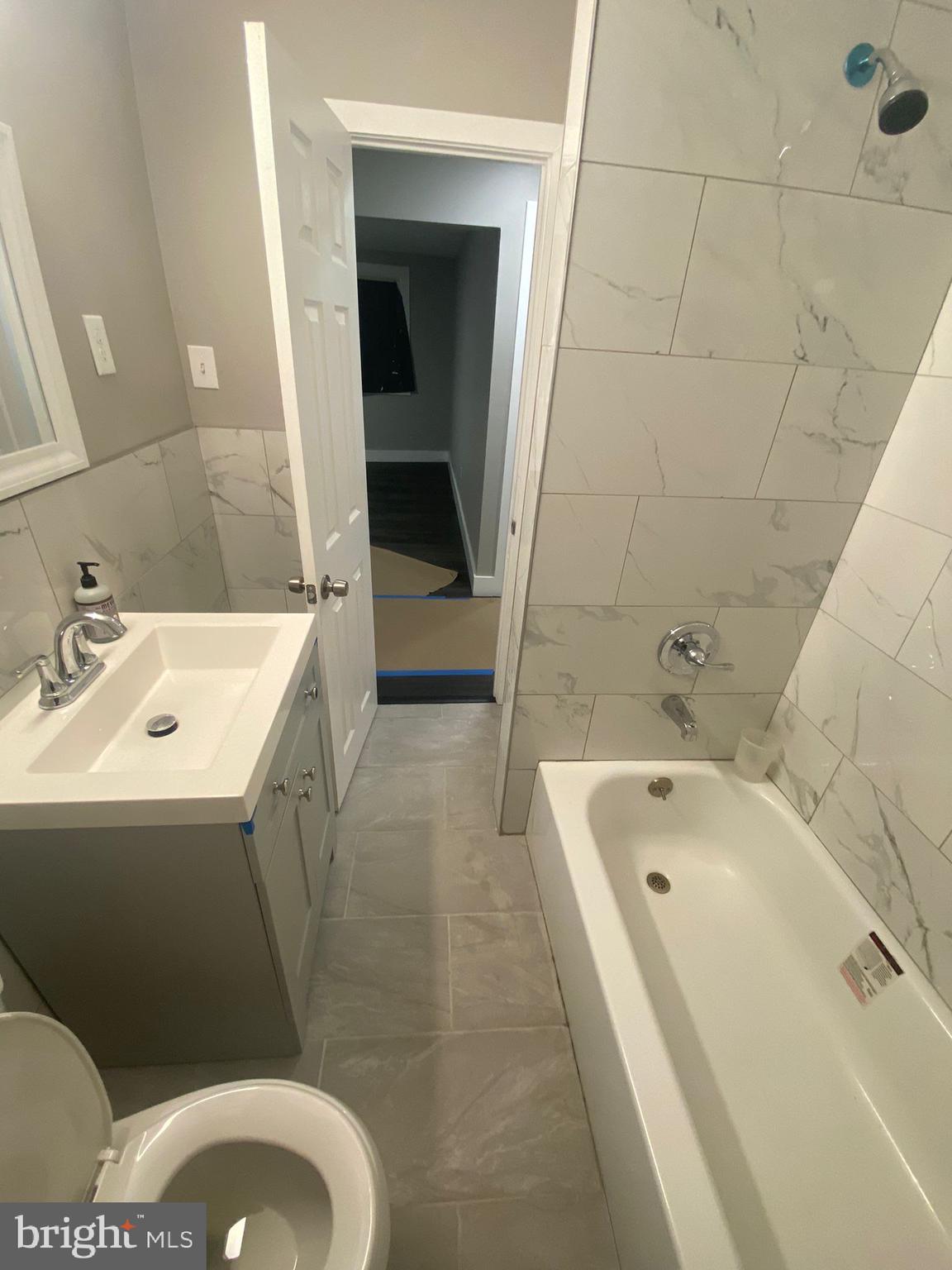 203 Kinsley Road Pemberton, NJ 08068 - Photo 5 of 9 a bathroom with a sink toilet and shower