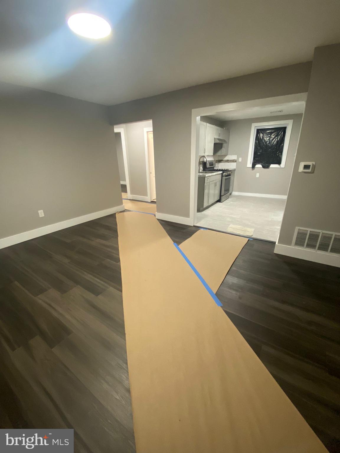 203 Kinsley Road Pemberton, NJ 08068 - Photo 7 of 9 a view of a living room with furniture and wooden floor