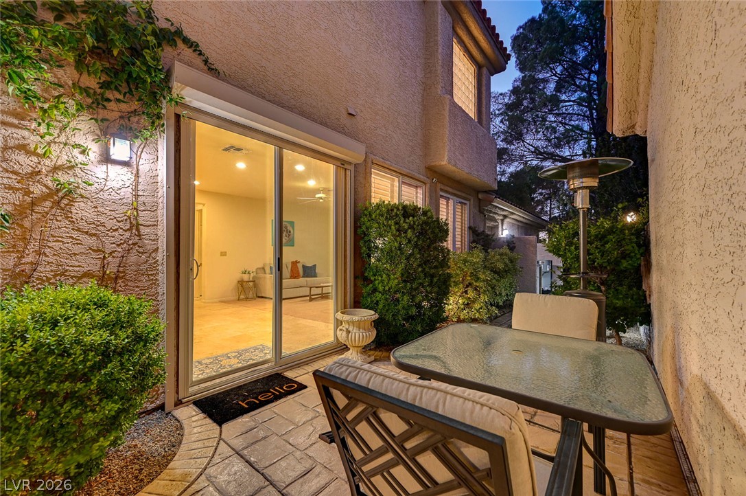 7995 Rio Rico Drive Las Vegas, NV 89113 - Photo 61 of 92 A quaint patio area offers intimate outdoor dining adjacent to verdant landscaping.