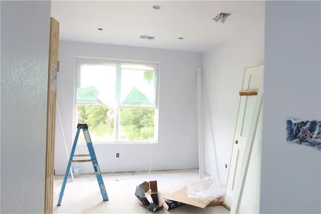 a view of an empty room with a window