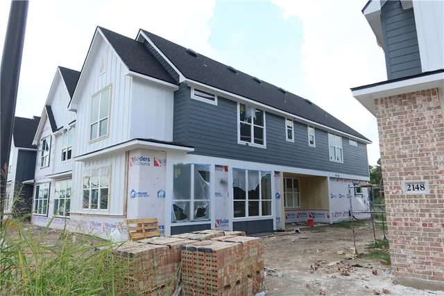 a front view of brick house with street