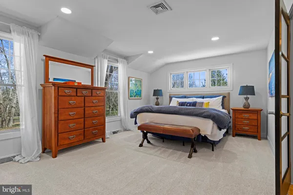 a bed room with a bed and a chandelier