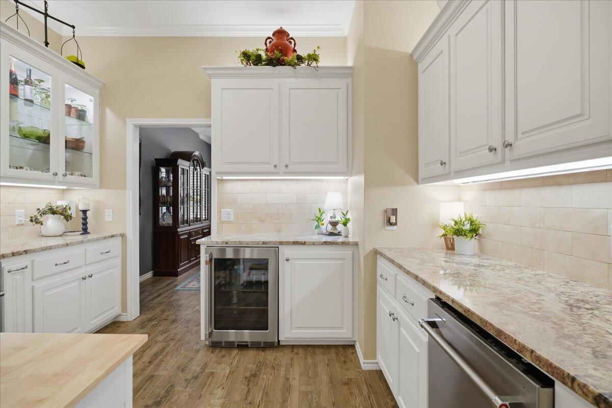 4612 100th Street Lubbock, TX 79424 - Photo 17 of 55 a kitchen with granite countertop cabinets stainless steel appliances and a counter space