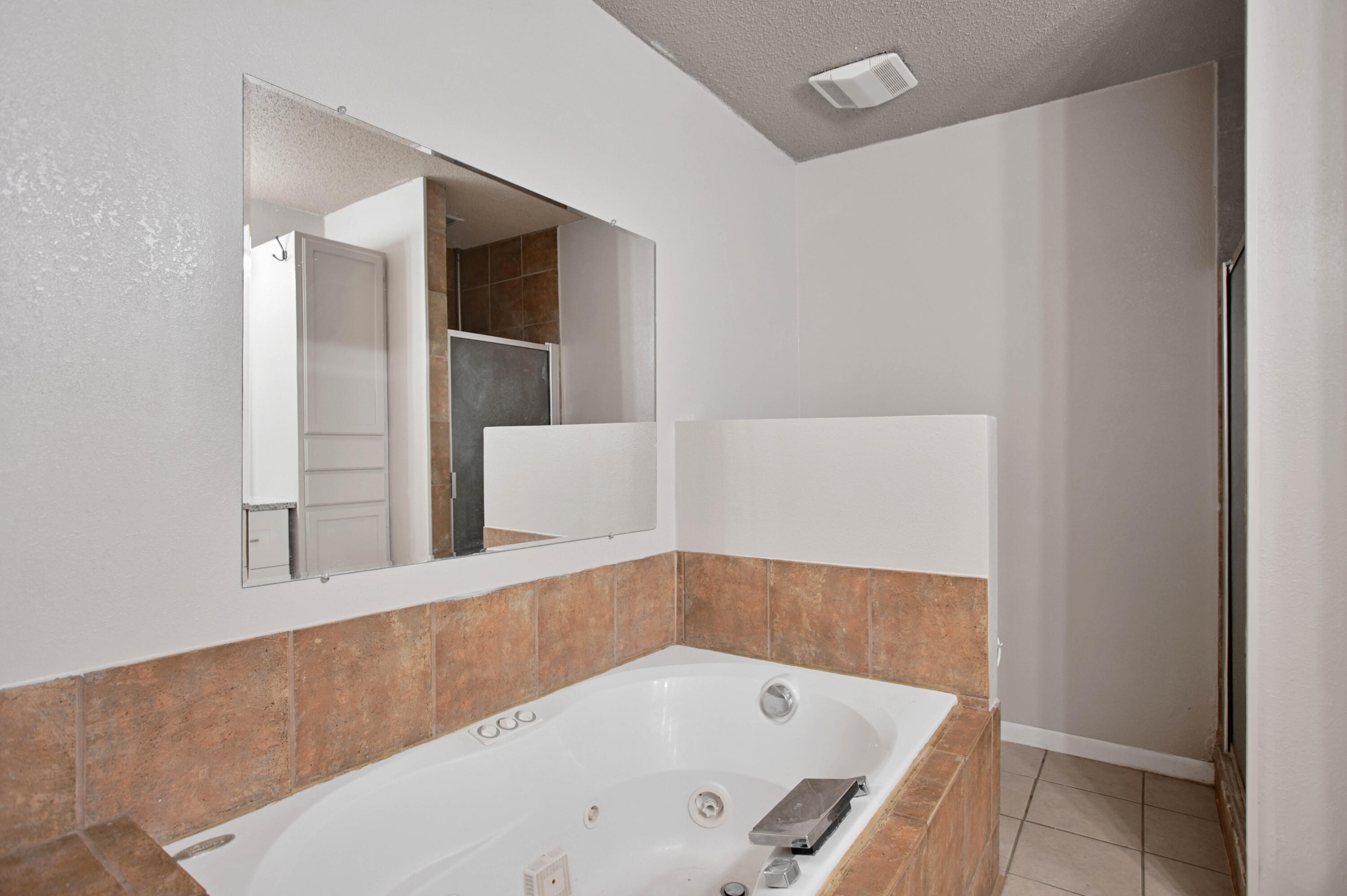 704 4th Street Smyer, TX 79367 - Photo 31 of 38 a bathroom with a tub and shower