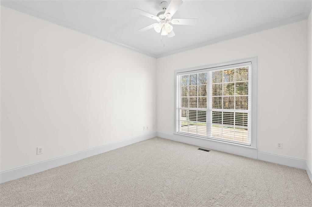 1030 Lakeview Parkway Villa Rica, GA 30180 - Photo 17 of 46 an empty room with a window and a ceiling fan